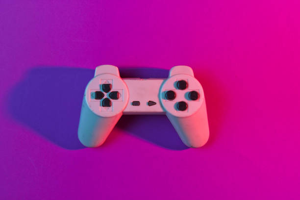 istock Retro gempad in neon pink light. Minimalism, top view 1153463513