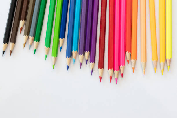 istock Many colored pencils, many colors on a white table 1153463535