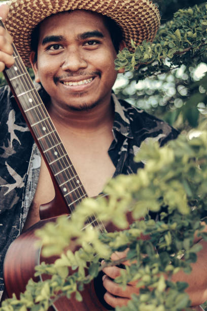 istock Happy Farmer Playing Guitar 1153463595