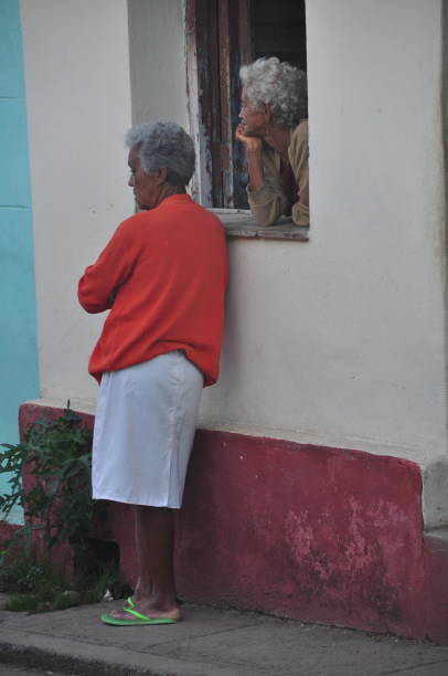 So much of Cuban life takes place on the city streets: negotiating with ambulant vendors, gossiping and board games with neighbors, picking up a wifi signal in one of the rare spots with a strong signal, preparing food for dinner, etc. Photos taken in Trinidad on 1/16/2016.