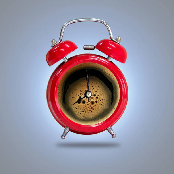 istock Alarm clock twin Bell-type red with espresso coffee background. 1153464664