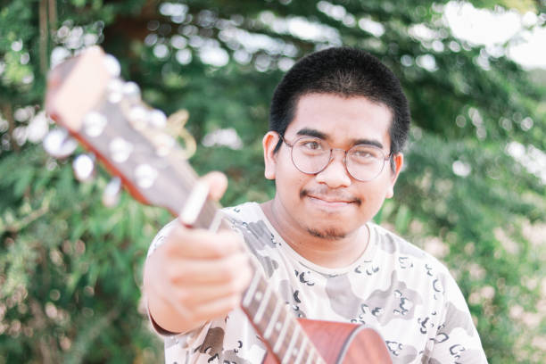 istock Happy Farmer Playing Guitar 1153464960