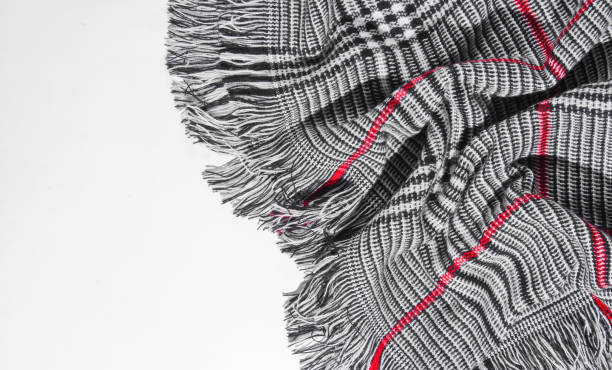 istock Trendy autumn scarf on a white background with space for text. 1153464987