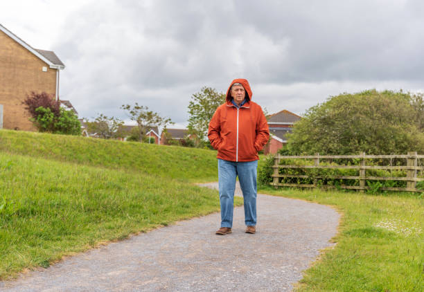 istock Active senior man walking in countryside 1153465166