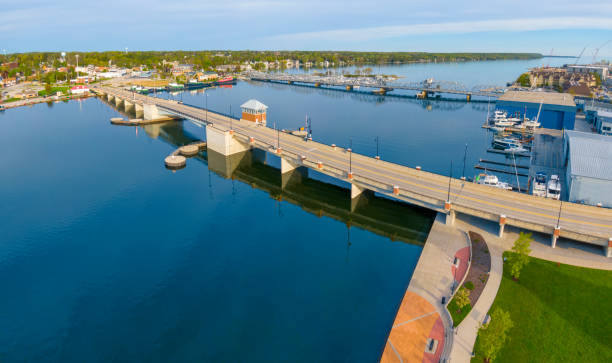 istock New bridge and old bridge, side by side, aerial view. 1153465892