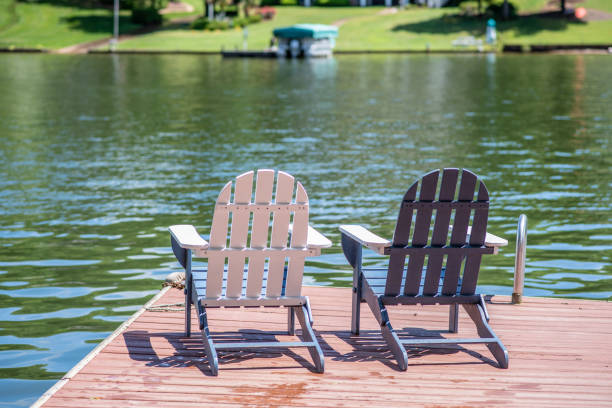 istock Adirondack chairs on a lake 1153466381