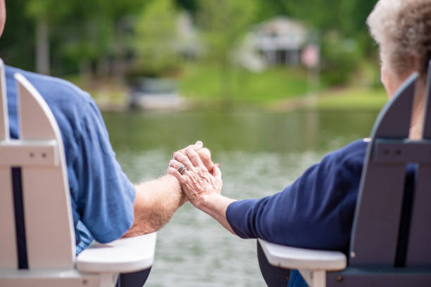 istock Senior couple holding hands 1153466383