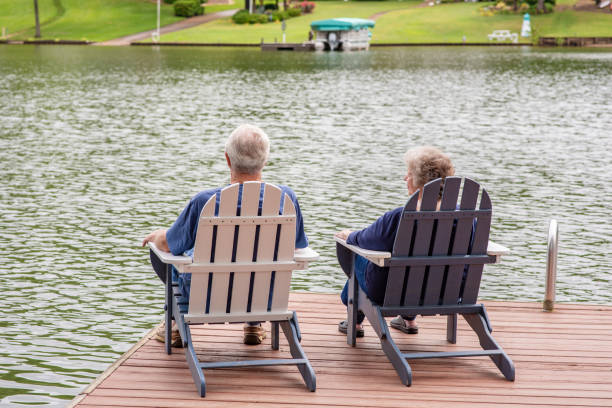 istock Senior couple overlooking a lake 1153466403