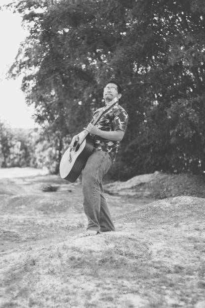 istock Happy Farmer Playing Guitar 1153466684