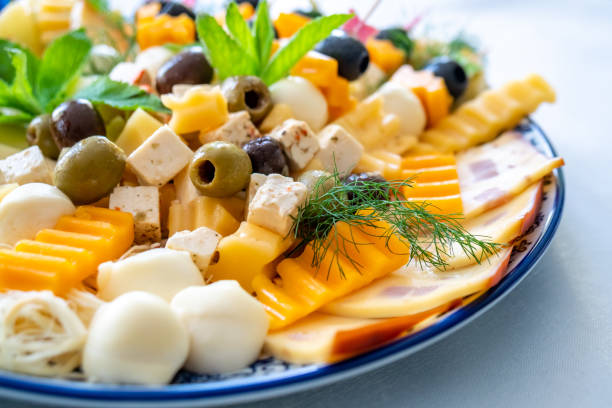 istock Fruit and vegetable salads with olive, cheese and other ingredients. 1153466817