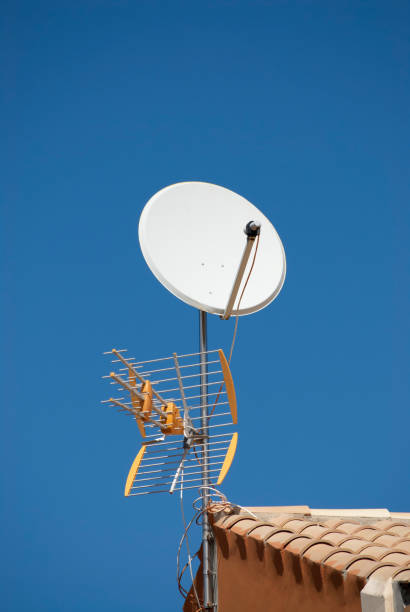 istock TV aerial and satellite dish fixed to the roof 1153470837