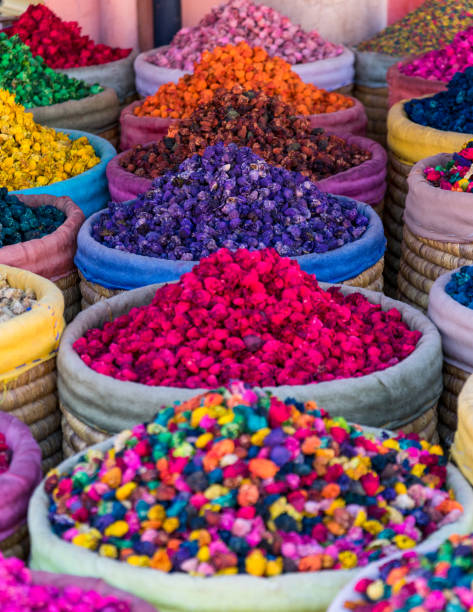 Multicolored dried flowers on sale in the souks of Marrakesh's medina in Morocco stock photo