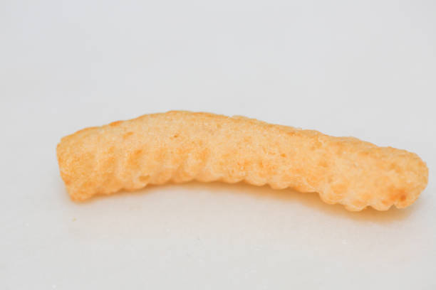 istock Closeup Shrimp cracker chips on a white paper plate. 1153472524