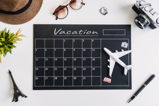 istock Vacation calandar with camera and travel items, Top view 1153472959