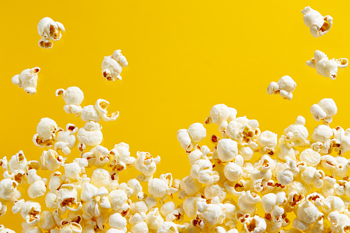 Close-Up Of Popcorn Against Yellow Background