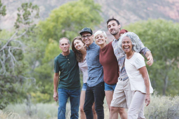 istock Multi-generational of friends posing together outside 1153475840