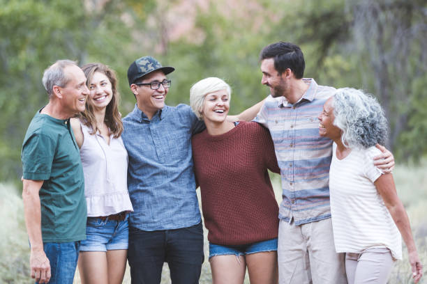 istock Multi-generational of friends posing together outside 1153475844