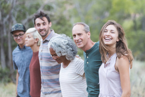 istock Multi-generational of friends posing together outside 1153475847