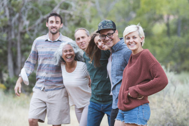 istock Multi-generational of friends posing together outside 1153475857