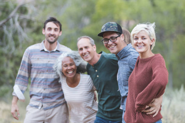 istock Multi-generational of friends posing together outside 1153475859