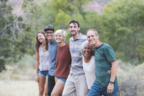 istock Multi-generational of friends posing together outside 1153475870