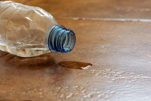 istock spilled water from a plastic bottle that fell on the floor 1153477168