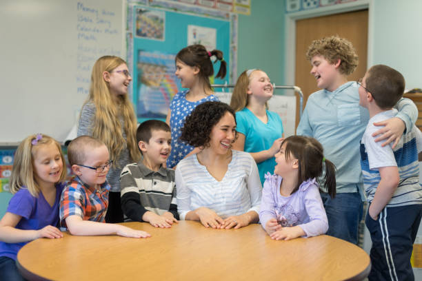 istock Group portrait of elementary teacher and her students 1153477902