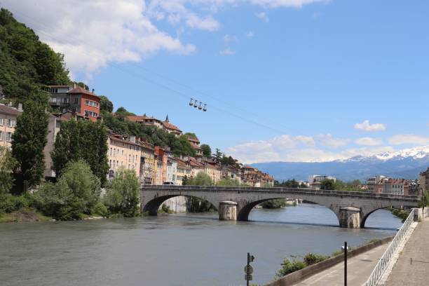 The docks of the Isère River in the city of Grenoble The banks of the Isère River in the city of Grenoble, Department of Isère, France isere river stock pictures, royalty-free photos & images