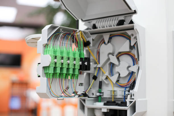 istock Fiber to the home equipment. FTTH internet fiber optics cables and cabinet 1153478956