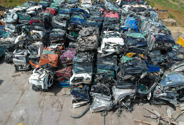 istock Cars in junkyard, pressed and packed for recycling. 1153479121