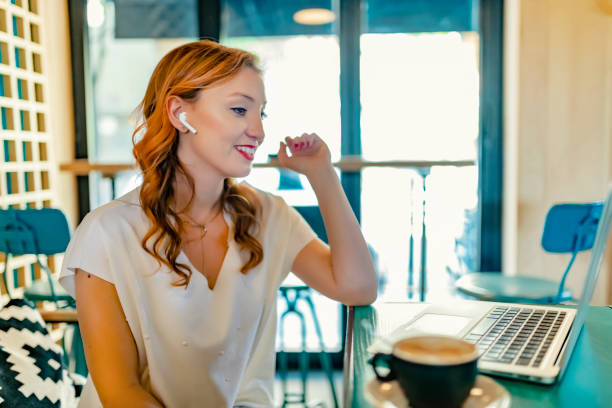 istock Businesswoman Using Laptop in Cafe 1153479433