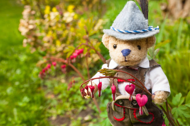 istock Cute little Gardener in Love with Blossoms 1153484314