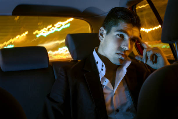 istock Businessman in a taxi 1153486799