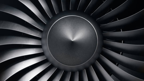 istock 3D illustration jet engine, close-up view jet engine blades. Front view of a jet engine blades. Rotating blades of the turbojet. Part of the airplane. Blades at the ends painted orange 1153489387