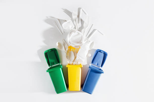 istock White single use plastic in garbage bins on  white background.
Concept of Recycling plastic. Flat lay, top view 1153490324