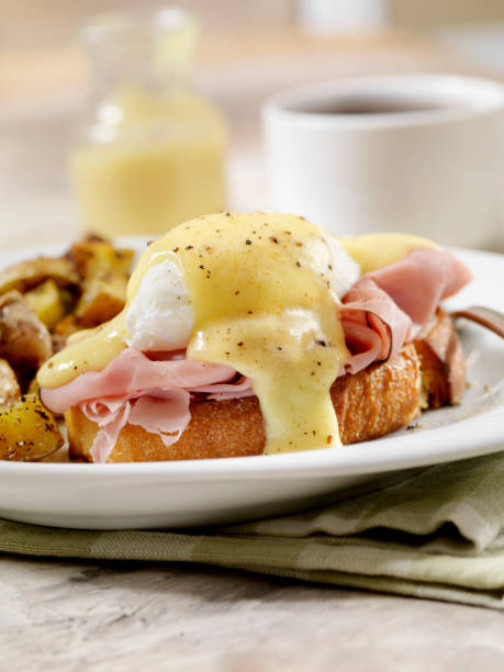 istock Eggs Benedict with Black Forest Ham and Hash Browns on Grilled French Bread 1153495818