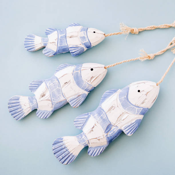 istock Decorative fish  on a  pastel blue background. Sea concept. Nautical pattern. 1153496021