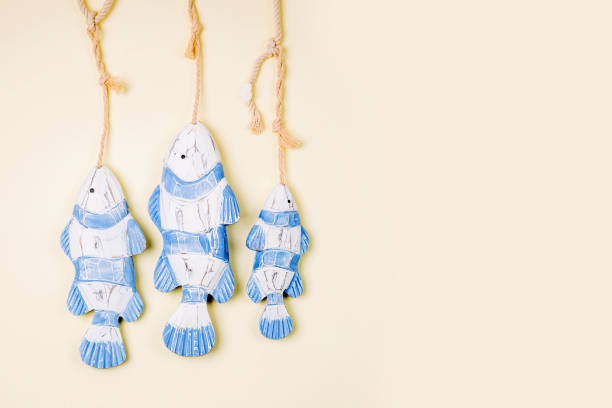 istock Decorative fish  on a  pastel background. Sea concept. Nautical pattern. 1153496166