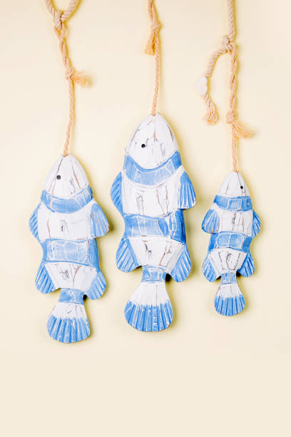 istock Decorative fish  on a  pastel background. Sea concept. Nautical pattern. 1153496210