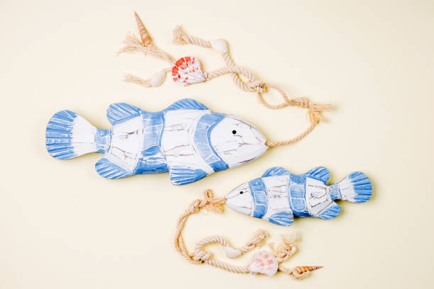 istock Decorative fish  on a  pastel background. Sea concept. Nautical pattern. 1153496340
