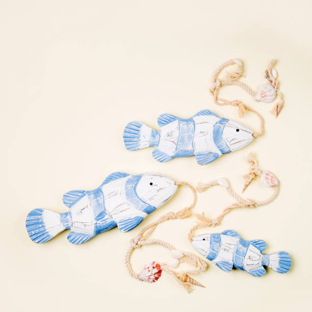 istock Decorative fish  on a  pastel background. Sea concept. Nautical pattern. 1153497462