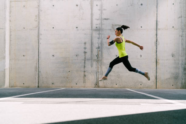 istock Sportswoman jogging 1153497557