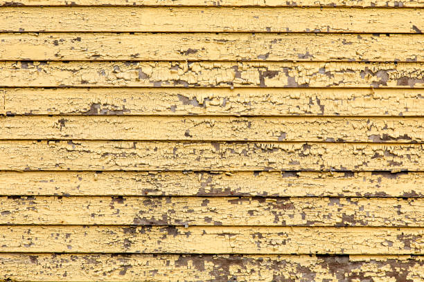 Outside wall that was that part of a house fire with peeling and melted paint. Image shot with Canon 5D Mark 4, 24-105mm f/4L IS USM lens.