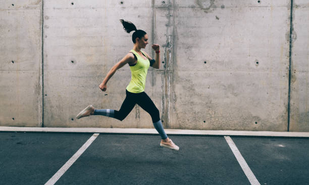 istock Sportswoman jogging 1153498099