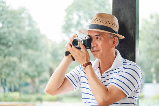 istock Tourist taking picture on camera 1153498577