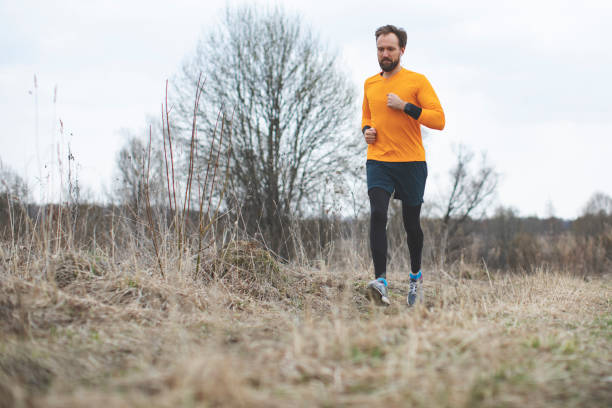 istock Young man running on the field 1153502866