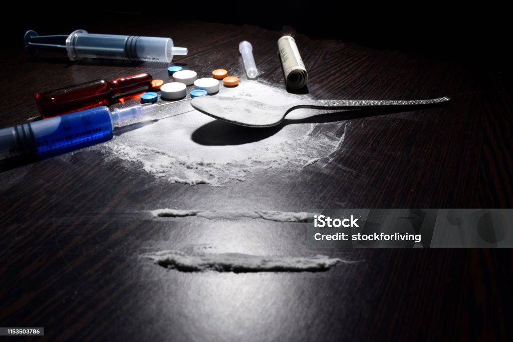 drugs concept , cocaine,injection,table,spoon on dark table Fentanyl Stock Photo
