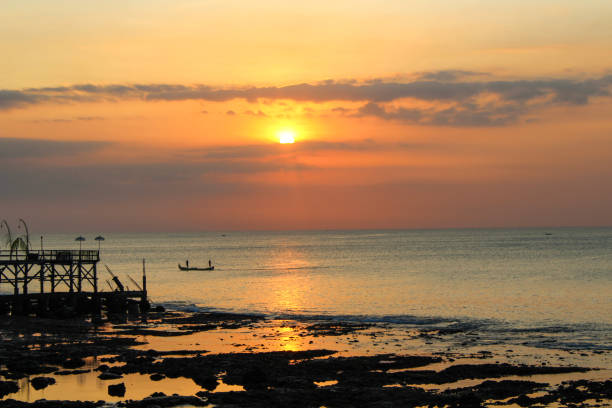 istock Sunset in Jimbaran, Bali, Indonesia 1153505097