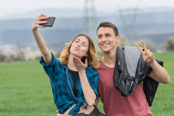 istock Couple walking in field and have fun. 1153505210