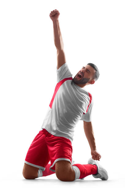 istock One professional soccer player celebrate victory. Happy celebration. Isolated on white background 1153505254